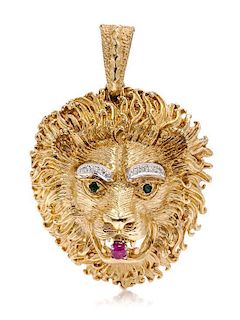 A 14 Karat Yellow Gold, Diamond, Ruby and Emerald Lion Pendant/Brooch, 30.70 dwts.