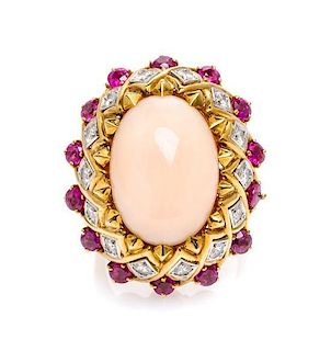 An 18 Karat Gold, Coral, Diamond and Ruby Bombe Ring, 17.70 dwts.