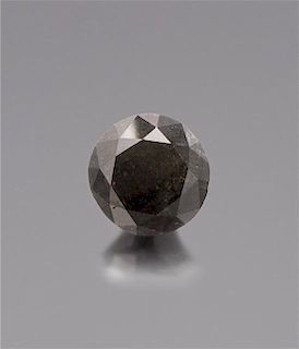 * A 24.29 Carat Round Brilliant Cut Natural Black Diamond, 3.10 dwts.