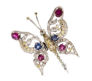 * A Platinum, Ruby, Sapphire, Diamond and Colored Diamond En Tremblant Butterfly Pendant/Brooch, 13.60 dwts.