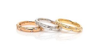 A Collection of 18 Karat Gold and Diamond Bands, 6.90 dwts.