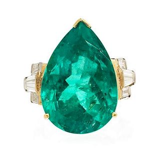 * A Platinum, Yellow Gold, Emerald and Diamond Ring, 9.10 dwts.
