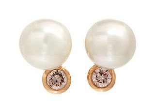 * A Pair of Gold, Cultured South Sea Pearl and Colored Diamond Earclips, 10.30 dwts.