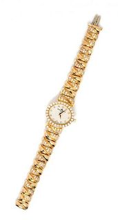 * An 18 Karat Yellow Gold, Diamond and Mother-of-Pearl Wristwatch, Baume & Mercier, 42.50 dwts.
