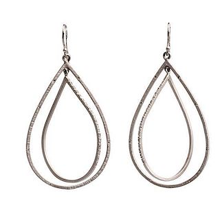 * A Pair of 14 Karat White Gold and Diamond Drop Earrings, 6.10 dwts.