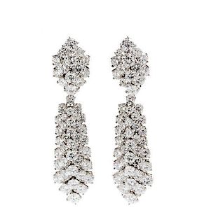 * A Pair of Platinum and Diamond Convertible Day/Night Earclips, Van Cleef & Arpels, 20.90 dwts.
