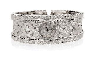 * An 18 Karat White Gold and Diamond Cuff Bracelet Wristwatch, Etoile, 52.90 dwts.