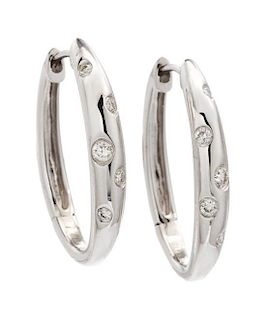 * A Pair of 18 Karat White Gold and Diamond Earrings, 7.40 dwts.