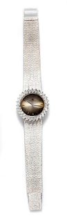 * An 18 Karat White Gold and Diamond Wristwatch, Bucherer, 43.00 dwts.