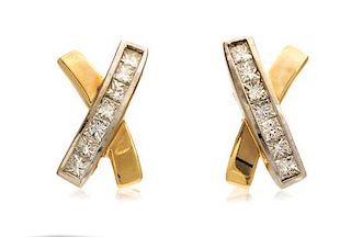A Pair of 14 Karat Yellow Gold and Diamond Earclips, 5.60 dwts.