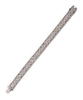 An Art Deco Platinum, Diamond and Synthetic Sapphire Bracelet, 16.20 dwts.