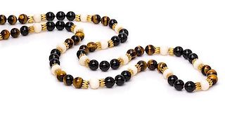* An 18 Karat Yellow Gold, Onyx, Tiger's Eye and Coral Bead Necklace,