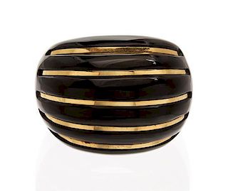 * A 14 Karat Yellow Gold and Onyx Dome Ring,