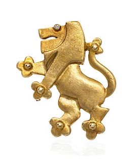 A 14 Karat Yellow Gold and Diamond Lion Pendant/Brooch, 9.40 dwts.