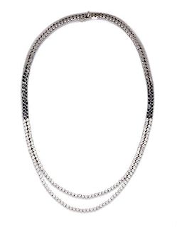 An 18 Karat White Gold and Diamond Swag Necklace, 37.90 dwts.