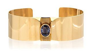 * A 14 Karat Yellow Gold and Sapphire Cuff Bracelet, 16.10 dwts.
