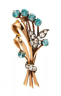 * A Retro Rose Gold, Silver, Blue Zircon and Paste Brooch, 6.95 dwts.