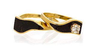 A Collection of 18 Karat Yellow Gold, Resin and Diamond Rings, 3.90 dwts.