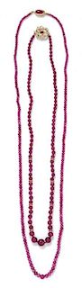 * A Collection of Single Strand Ruby Bead Necklaces,