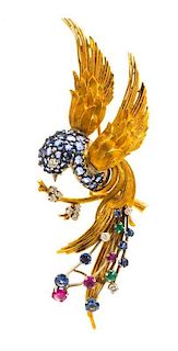 An 18 Karat Yellow Gold, Sapphire, Diamond, Ruby and Emerald Bird Brooch, 12.00 dwts.