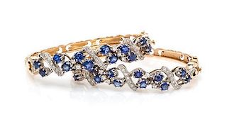 * A Pair of Gold, Sapphire and Diamond Bangle Bracelets, 36.30 dwts.