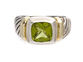 A Sterling Silver, 14 Karat Yellow Gold and Peridot Ring, 5.20 dwts.