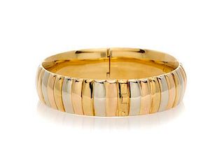 An 18 Karat Tri Color Gold Bangle Bracelet, 25.00 dwts.