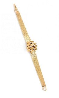 A 14 Karat Yellow Gold and Diamond Surprise Wristwatch, Omega, 16.40 dwts.
