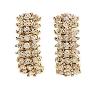 A Pair of 14 Karat Yellow Gold and Diamond Earclips, 3.80 dwts.