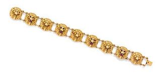 An Antique Yellow Gold, Ruby and Garnet Lion Motif Bracelet, 10.40 dwts.