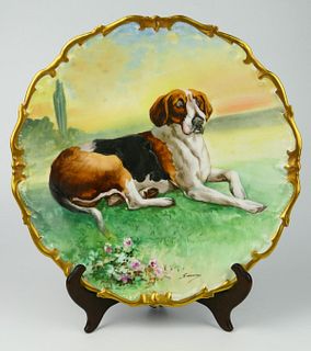 19TH CENTURY H.P. LIMOGES CHARGER OF A RESTING DOG