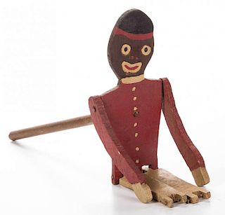 BLACK AMERICANA CARVED AND PAINTED WOOD STICK TOY