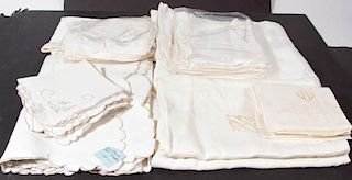 ASSORTED VINTAGE LINEN AND RAYON TABLE COVERINGS AND NAPKIN SETS, LOT OF FOUR