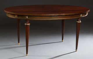 French Louis XVI Style Ormolu Mounted Carved Mahogany Oval Dining Table, 20th c., the oval top over a wide skirt, on ormolu mounted turned tapered leg