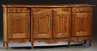 French Provincial Louis XV Style Carved Walnut Sideboard, 20th c., the stepped serpentine parquetry inlaid top over central fielded panel double cupbo