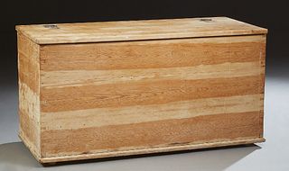 Danish Carved Pine Bedding Box, 19th c., with a divided interior, now stripped of finish, H.- 22 1/2 in., W.- 44 in., D.- 19 1/2 in.