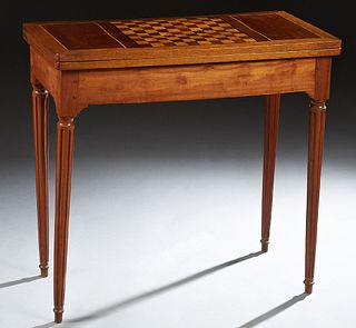 French Louis XVI Style Carved Mahogany Games Table, early 20th c., the top with an inlaid chess board, opening to a baize lined gaming interior, over 