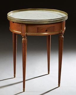 French Louis XVI Style Ormolu Mounted Carved Mahogany Marble Top Lamp table, early 20th c., the brass galleried circular white marble over a wide skir