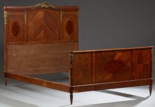 French Louis XV Style Ormolu Mounted Inlaid Mahogany Double Bed, c. 1910, the arched ormolu mounted headboard with three panels, to wooden rails and a