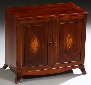 Georgian Style Inlaid Mahogany Collector's Cabinet, 20th c., the double shell inlaid doors opening to six shallow drawers, on a plinth base on bracket