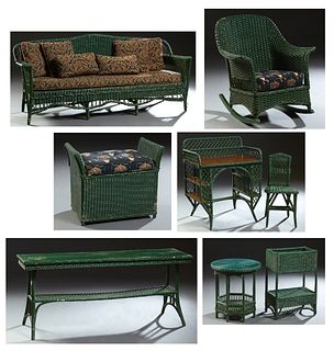 Nine Piece Woven Wicker Porch Set, early 20th c., New Orleans, consisting of a settee with cushions, a desk and chair, a circular cocktail table, a ta