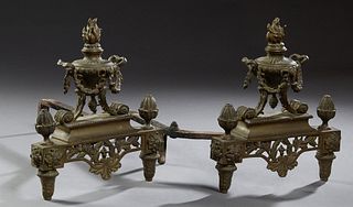 Pair of French Bronze Louis XVI Style Chenets, 19th c., with handled bronze garland draped urn surmounts, flanked by urn finials, on a rectangular bas