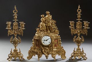German French Gilt Brass Figural Clock Set, 20th c., by Imperial, the top surmounted by a courting couple on an enamel dial drum clock, time and strik