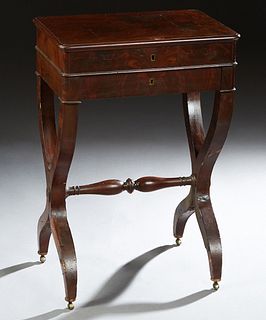 French Carved Mahogany Travailleuse, c. 1870, the lifting lid with an interior mirror over a compartmented area with two lidded compartments, above a 