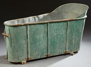 French Provincial Old Zinc Tub, 19th c., of tapered form, with iron handles on flat board plinths, H.- 29 3/4 in., W.- 25 in., D.- 60 in.
