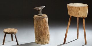Three French Provincial Items, 19th c., consisting of an iron anvil mounted on a log; a chopping block on splayed tripodal legs; and a milking stool, 