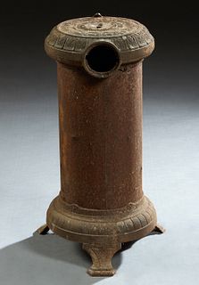 French Cast Iron Circular Room Heater, 29th c., by Godin, coal burning, H.- 25 3/4 in., Dia.- 15 in.