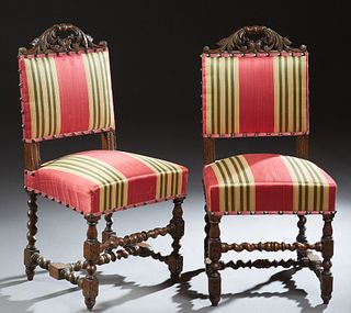 Pair of French Provincial Henri II Style Carved Oak Side Chairs, c. 1880, the leaf carved crest with a pierced hand hole, to an upholstered back over 