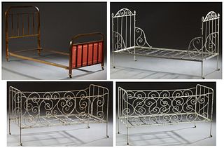 Group of Four French Beds, 19th c., consisting of four folding iron "campaign" beds, three with scrolled decoration, and a brass single bed, the footb