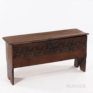 Carved Oak Six-board Chest, England, late 17th/early 18th century, the molded lift top above a fleur-de-lis-carved facade and cutout si